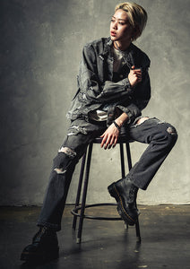 Distressed tapered denim pants