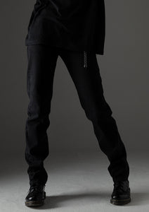Distressed tapered denim pants